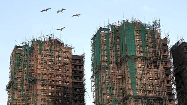 Hong Kong fire: Echoes of loss below burnt towers
