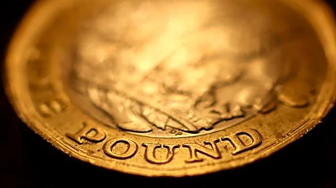 Sterling ticks lower as traders brace for busy week