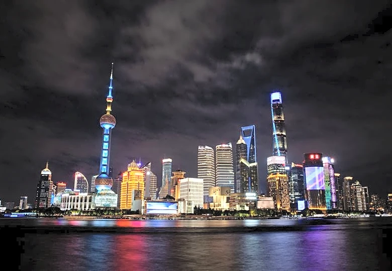 IMF urges China to speed up structural reform, raises growth forecasts