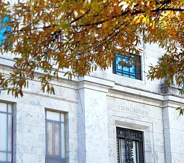 Divided Fed lowers rates, signals pause and one 2026 cut as growth rebounds