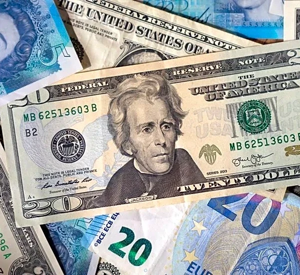 Dollar slides as Fed dents hawks, markets eye two more rate cuts