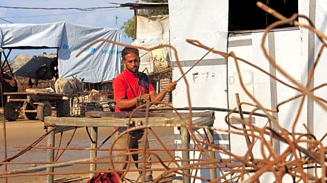 Desperate Gazans pull iron bars from rubble to construct tents and scratch out a living