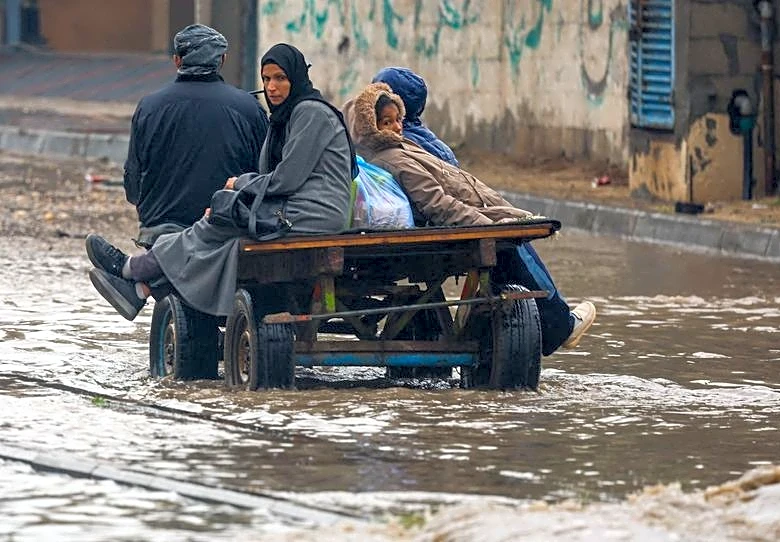 Rain has flooded Gaza tents and a baby died of exposure, medics say