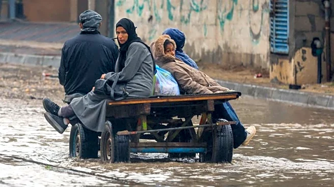 Rain has flooded Gaza tents and a baby died of exposure, medics say