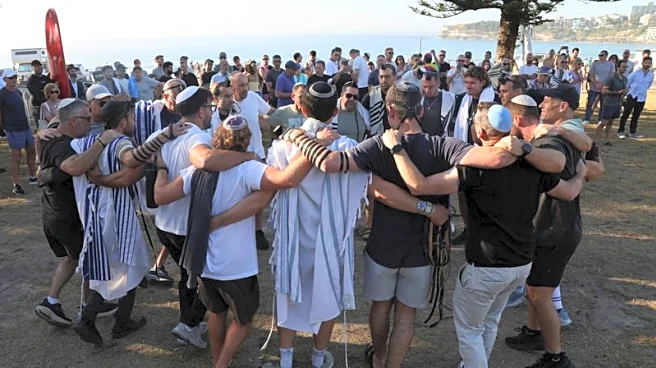Australian Jews hold prayers, hundreds of surfers paddle out at Bondi to honour shooting victims