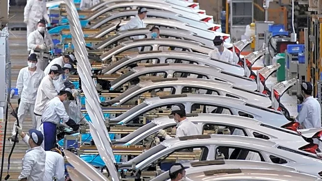 China's factory activity edges back to growth in December, private PMI shows