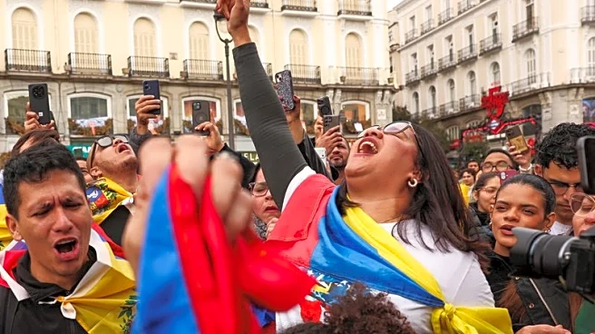 Venezuelan opposition activists in Madrid warily cheer Maduro capture