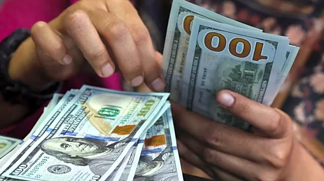 Dollar holds steady as mixed data sets up Friday's jobs report