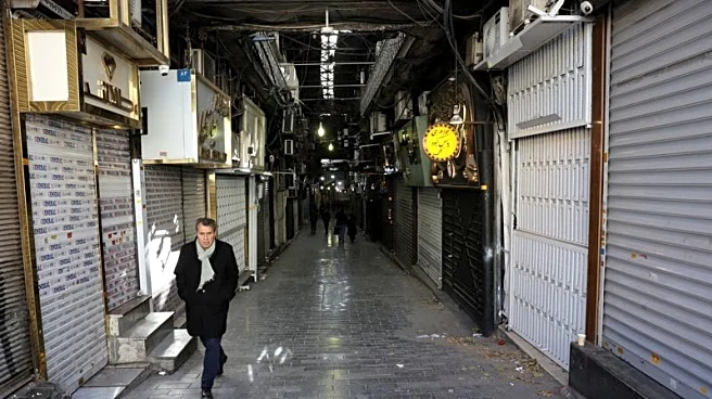 Iran's traders, frustrated by economic losses, turn against clerics