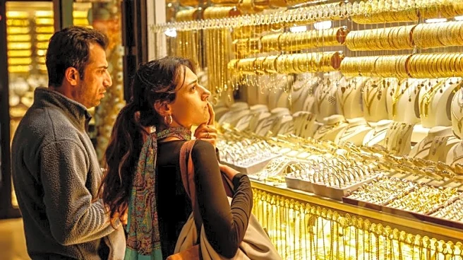 Factbox-UBS raises gold price target to $6,200/oz