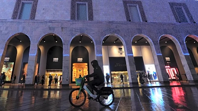 Olympics-Milan greets Games with mixture of pride and misgivings