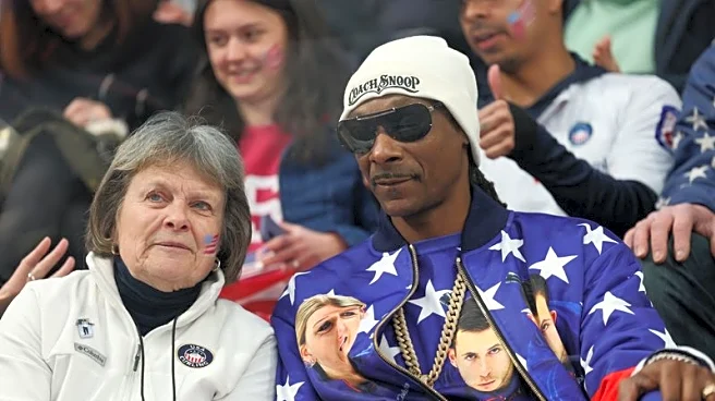Olympics-Curling-Snoop Dogg in the house: Rapper cheers US to mixed doubles win