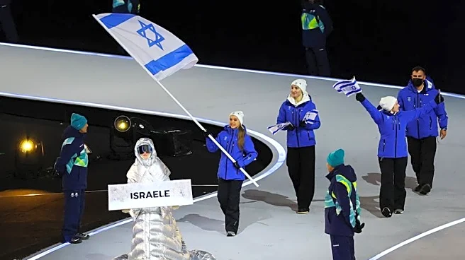 Olympics-Israel team marches to smattering of boos at Milan Games opening ceremony