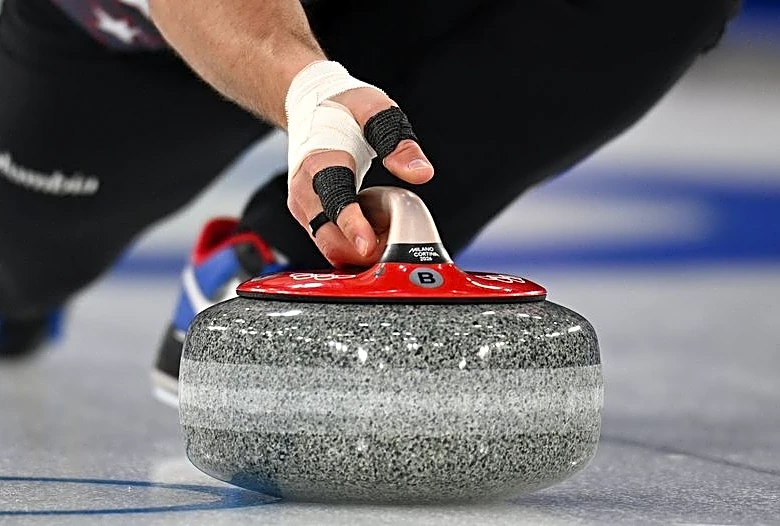 Olympics-Curling-Compartmentalising the key for curlers pulling double duty at Games