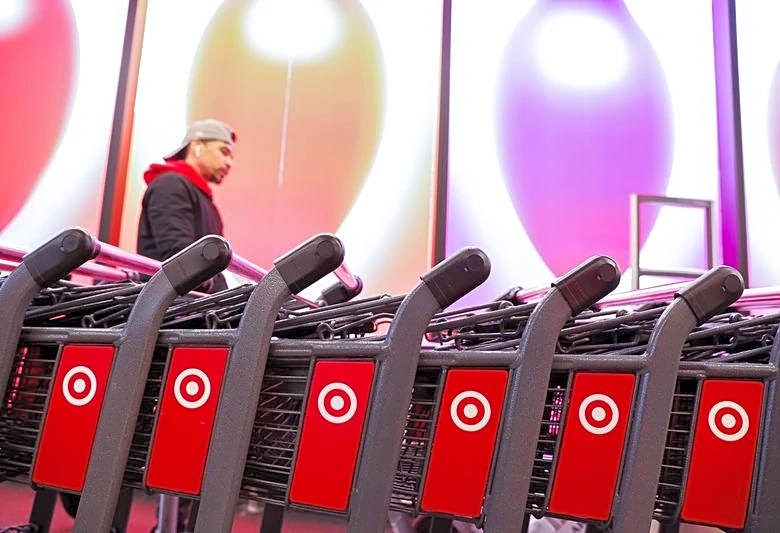 Target steps up investment in store staffing, cuts about 500 other roles