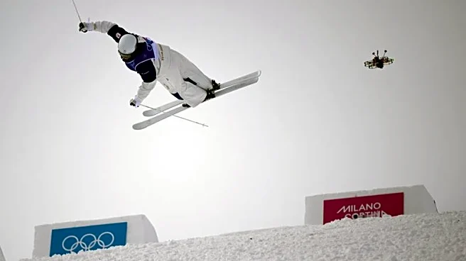 Olympics-Freestyle skiing-Japan's Horishima tops moguls qualifying, Kingsbury and Wallberg also advance