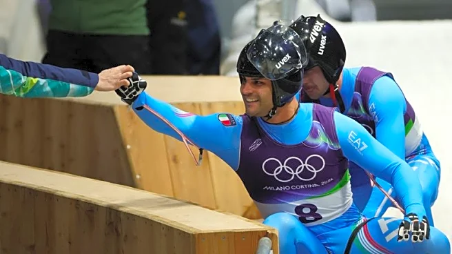 Olympics-Luge-Italian men complete golden doubles double for hosts