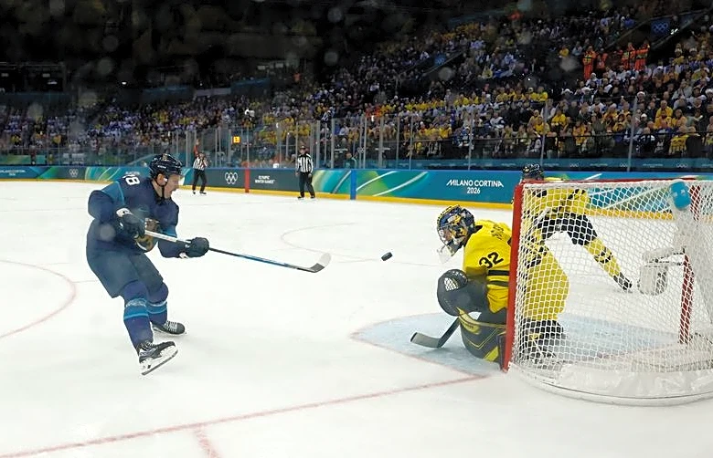 Olympics-Ice hockey-Finland muscle past Sweden, Slovakia beat hosts Italy