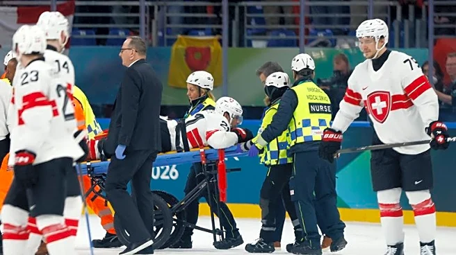 Swiss F Kevin Fiala (leg) stretchered off vs. Canada
