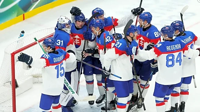 Olympics-Ice hockey-Slovakia win group, US beat Denmark, Finland, Latvia notch wins