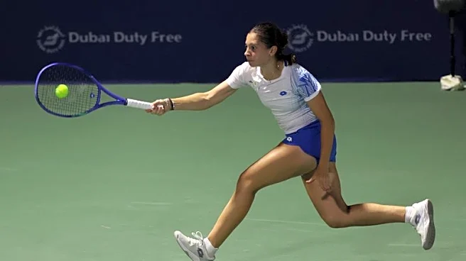 Tennis-Ruzic grabs Dubai spotlight as lucky loser shocks Raducanu