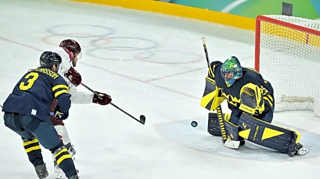 Olympics-Ice hockey-Sweden beat Latvia to set men's quarter-final meeting with US