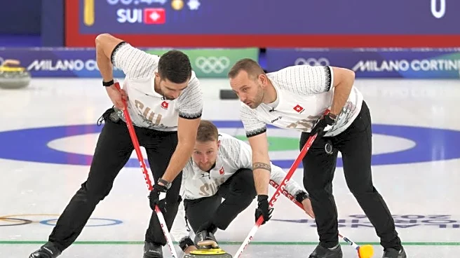 Olympics-Curling-Switzerland's Schwaller following in father's footsteps at Winter Games