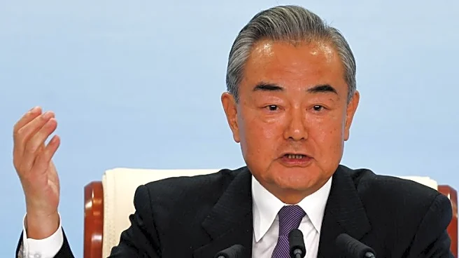 China's foreign minister tells Israeli counterpart that attacks on Iran must end