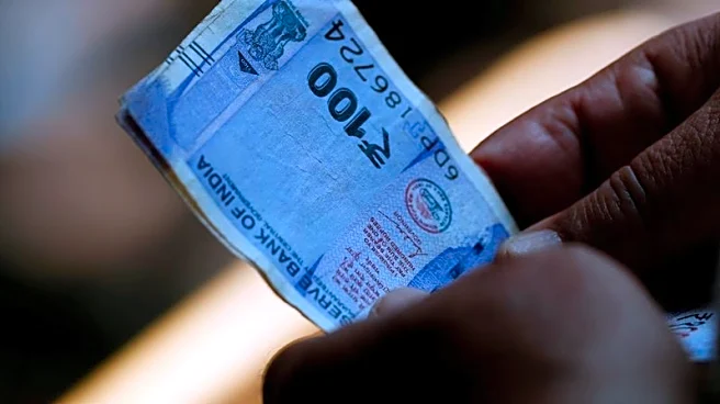 Renewed oil surge pummels Indian assets, pushes rupee to record low