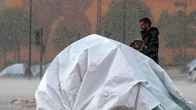 In heavy rain, Lebanese fleeing war huddle under makeshift shelters