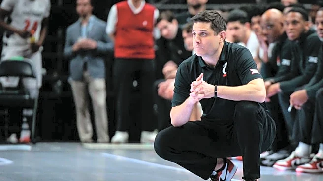 Charlotte hires former Cincinnati coach Wes Miller