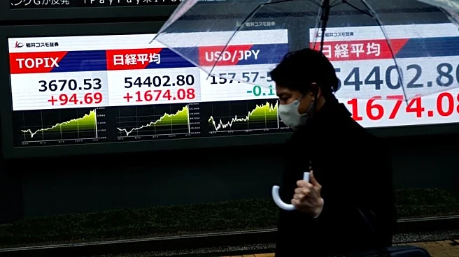 Stocks slide in Asia, Brent crude heads for record monthly rise