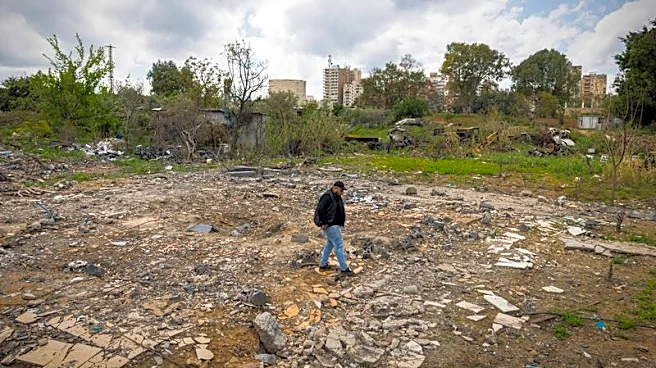 Lebanese man scours home bombed by Israel for mementos of his slain family