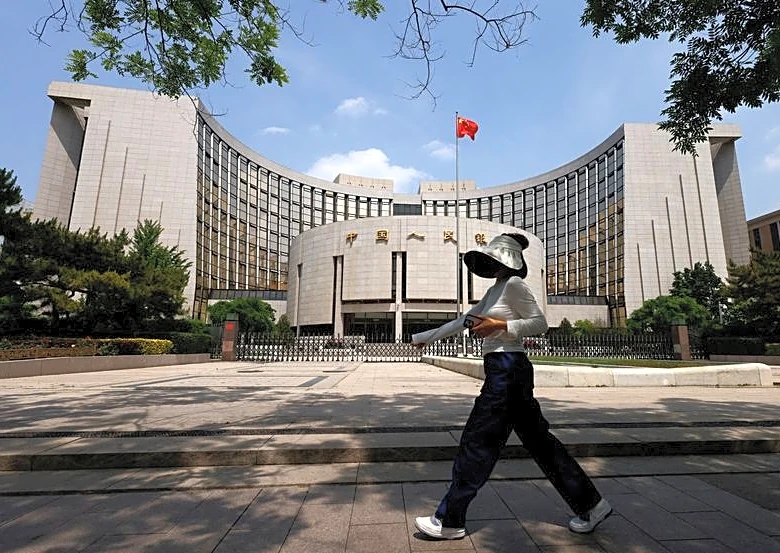 Global banks scale back China rate-cut calls, see policy rate on hold this year