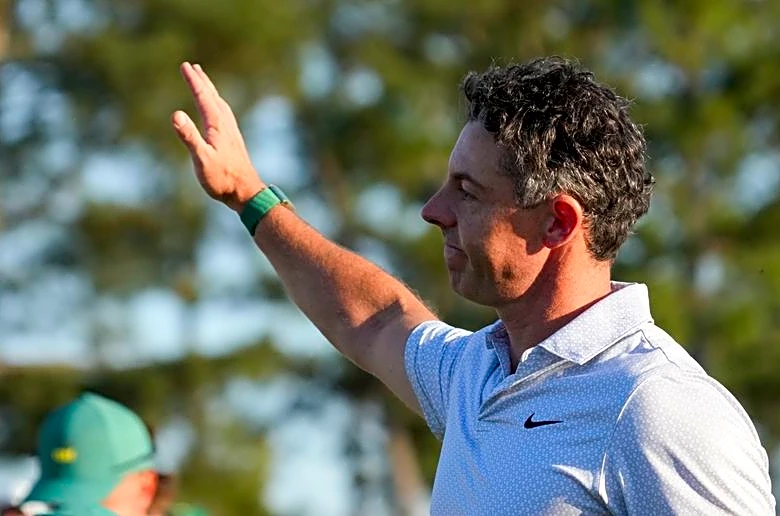 Golf-Carefree McIlroy strengthens grip on Masters title defence