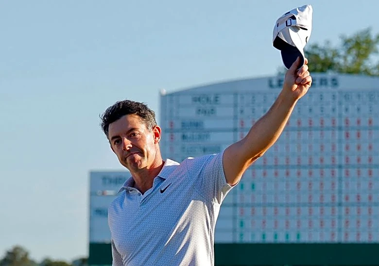 Golf-McIlroy looks to build on six-shot Masters lead