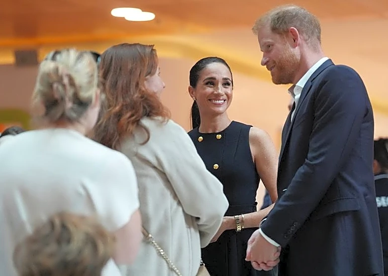 Prince Harry and Meghan arrive in Australia to a muted welcome