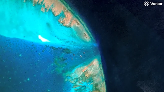 Exclusive-China moves to block entrance to disputed South China Sea shoal, images show