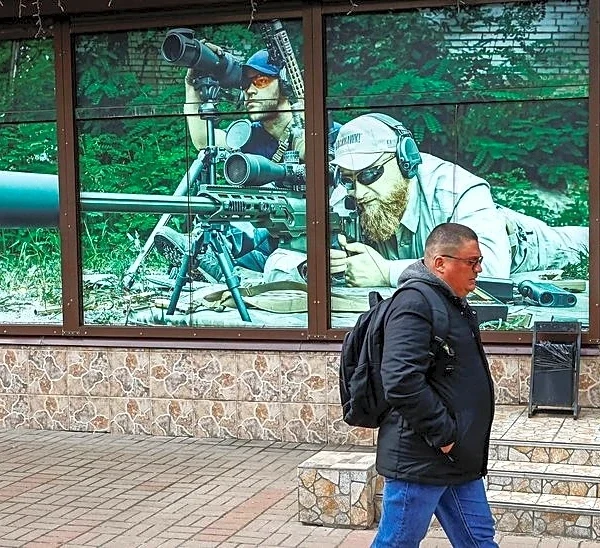 Analysis-Mass shooting reignites push to loosen gun laws in war-torn Ukraine