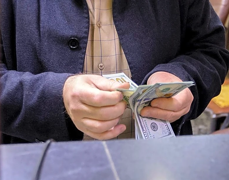 US halts Iraq dollar cash shipment after militia strikes, sources say