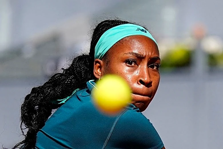 Tennis-Gauff battles through illness to reach Madrid Open last 16