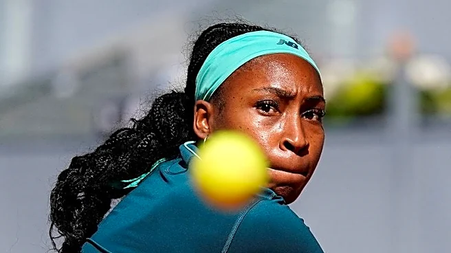 Tennis-Gauff battles through illness to reach Madrid Open last 16
