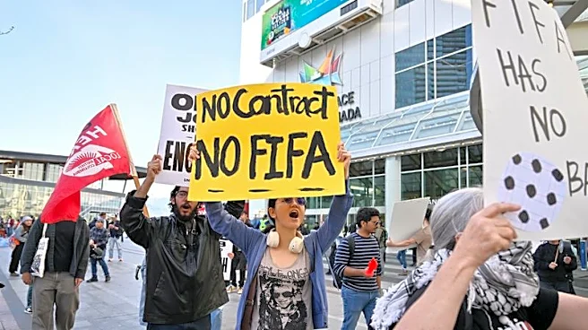 Soccer-Advocates for homeless, hotel workers rally outside FIFA Congress in Vancouver