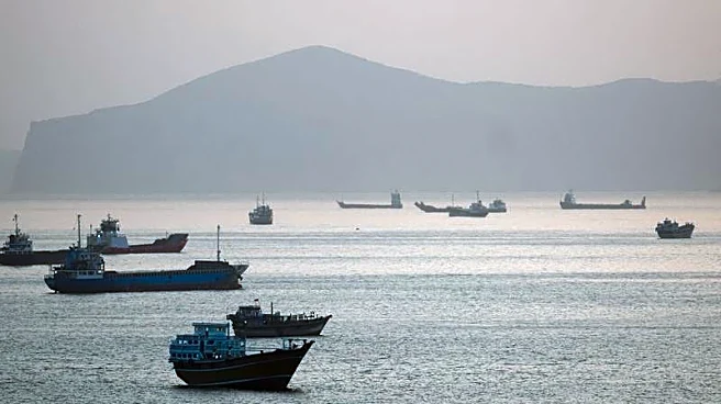 Trump says US to help ships stranded in Strait of Hormuz as tanker hit by projectiles