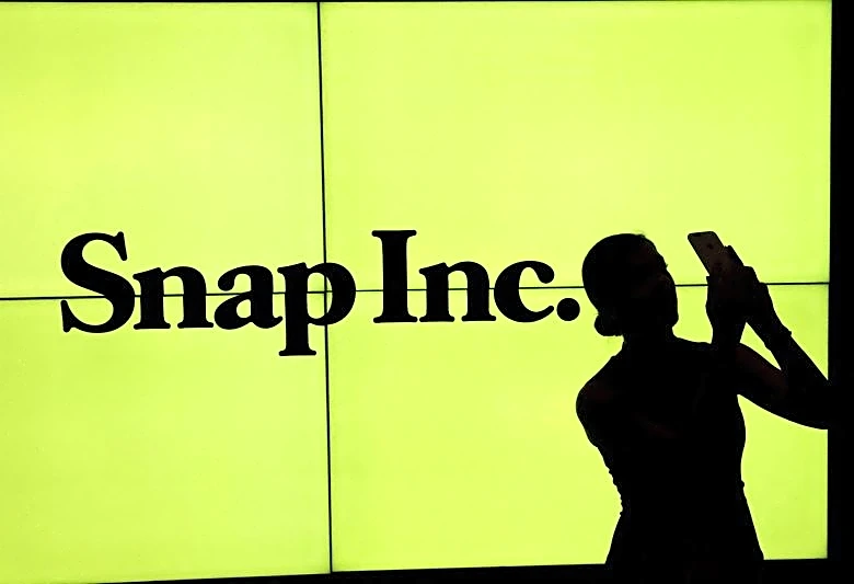Snap's quarterly revenue rises, daily active users return to growth