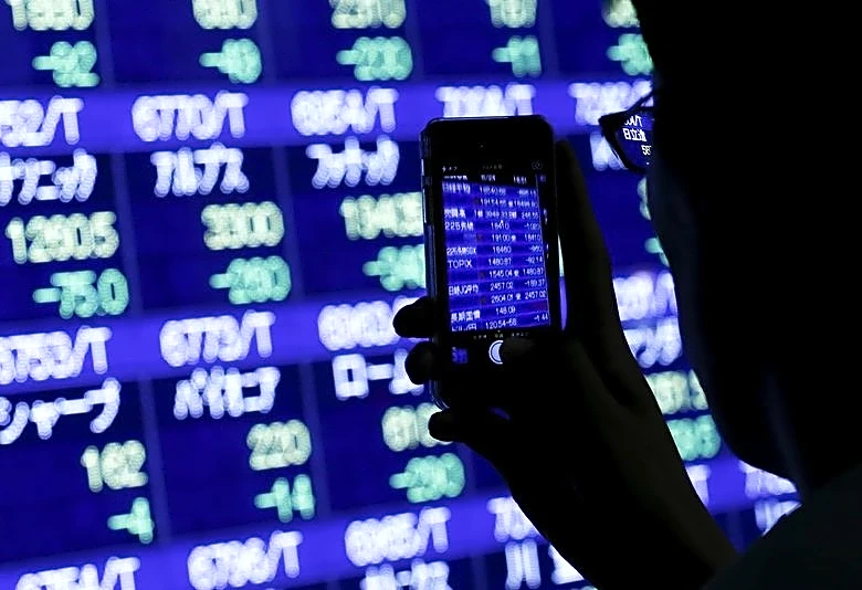 Oil jumps and stock futures slip on renewed US-Iran fighting