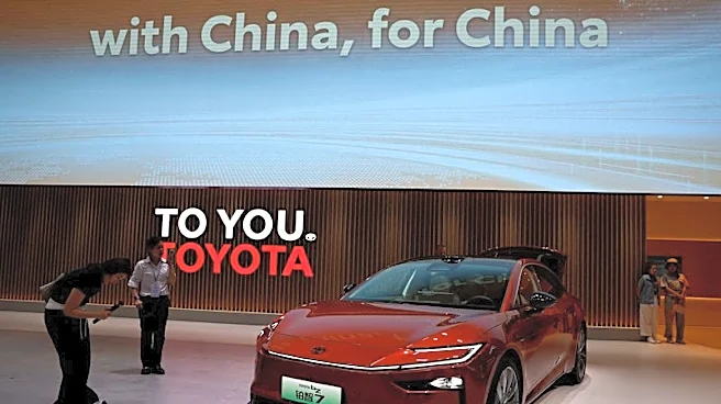 Toyota halves quarterly profit as Iran crisis hits