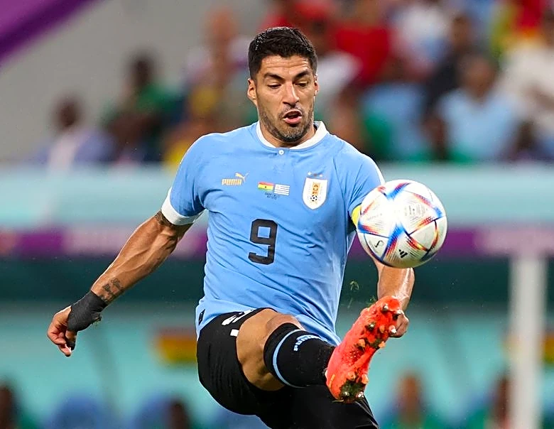 Soccer-Suarez open to Uruguay return for World Cup