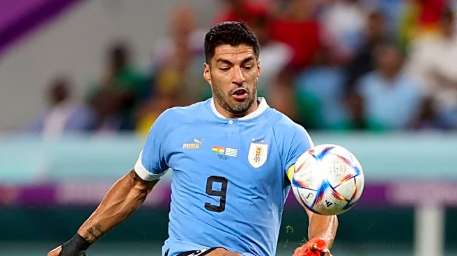 Soccer-Suarez open to Uruguay return for World Cup