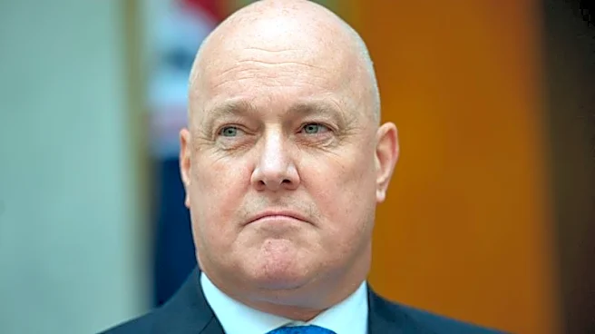 NZ trims new spending, sticks to surplus path as global risks heighten